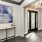 a room with a table and a wall with art on it