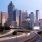 a city skyline with a freeway
