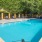 a swimming pool with chairs around it
